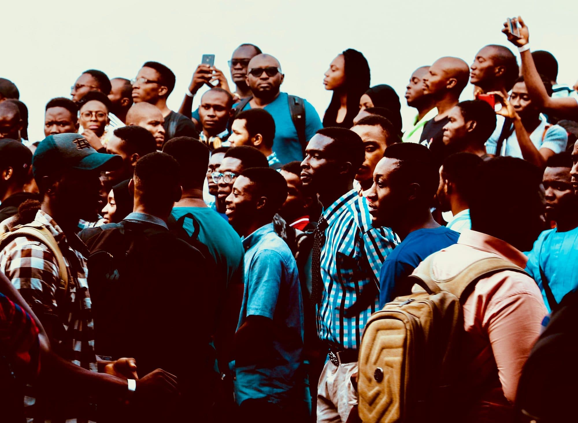 A large crowd of young people gathered together