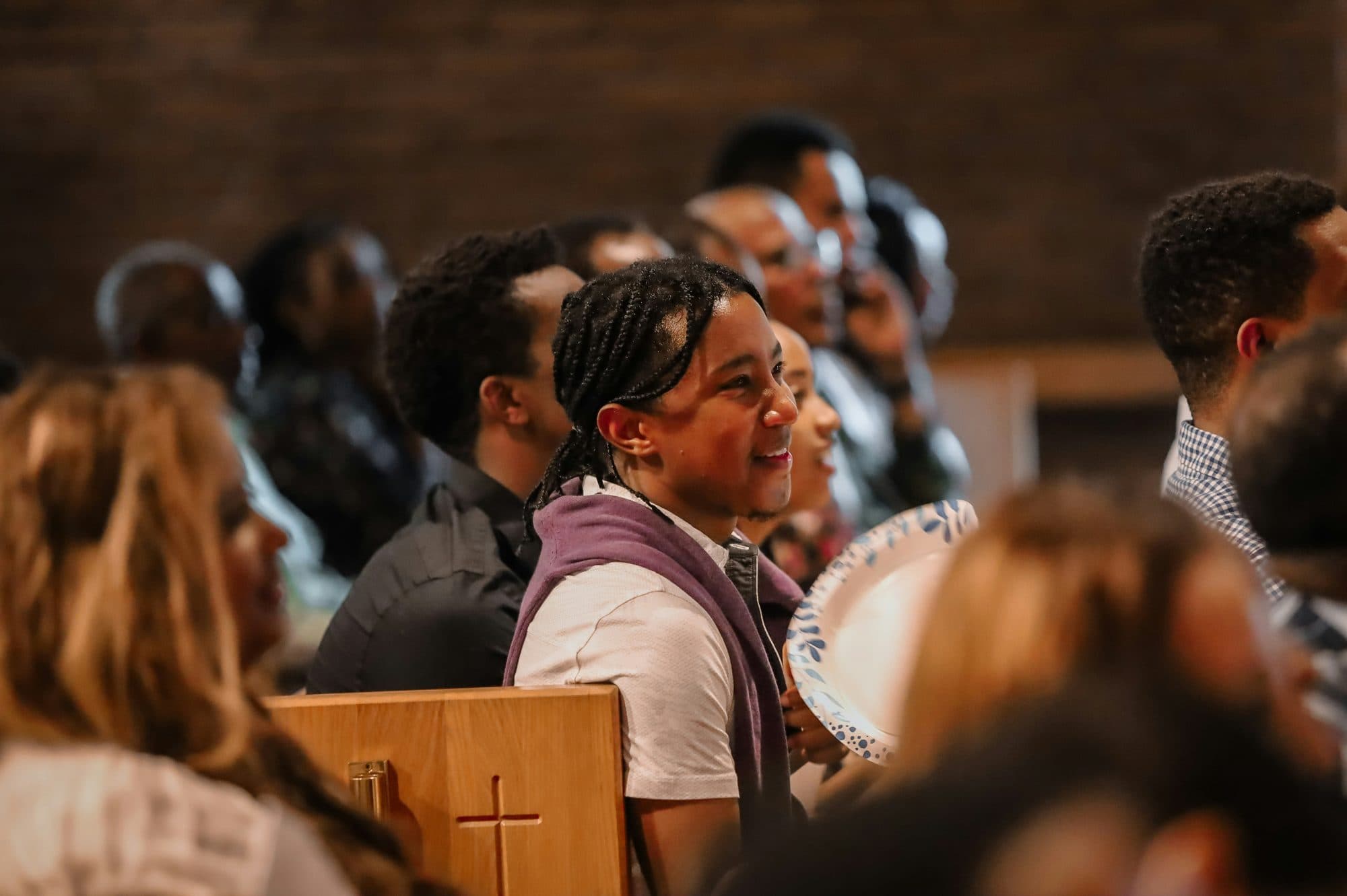 Young people smiling together in church